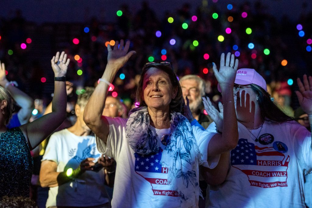 Supporters of Vice President Kamala Harris dance before a rally for her presidential campaign Friday, Sept. 20, 2024, at the Alliant Energy Center in Madison, Wis. Angela Major/WPR