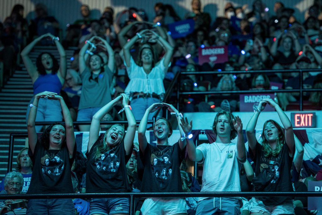 Rally attendees dance to music played in between speakers Friday, Sept. 20, 2024, at the Alliant Energy Center in Madison, Wis. Angela Major/WPR