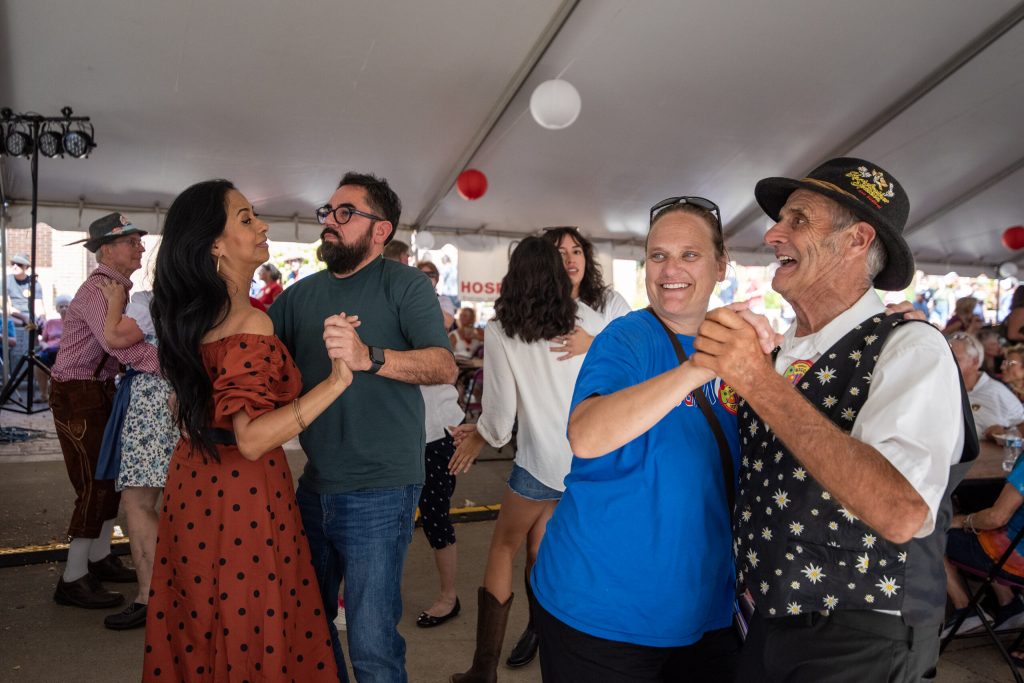 People dance in one of the tents at Green County Cheese Days on Saturday, Sept. 21, 2024, in Monroe, Wis. Angela Major/WPR