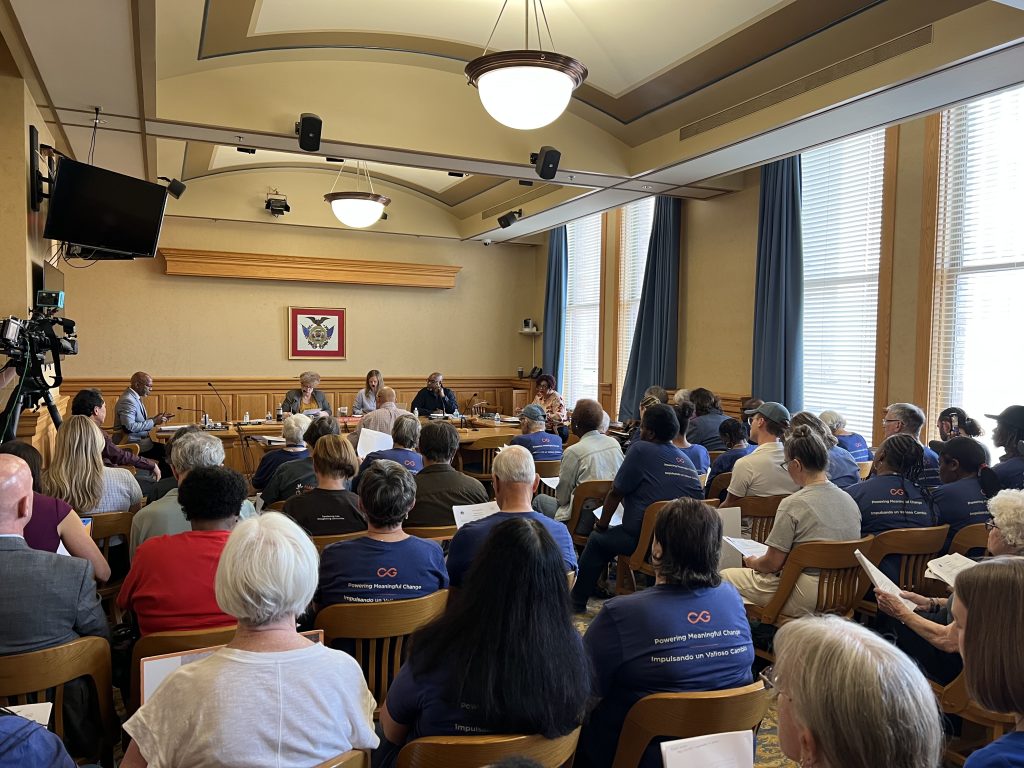 Common Ground members fill a Housing Authority of the City of Milwaukee board meeting. Photo by Jeramey Jannene.