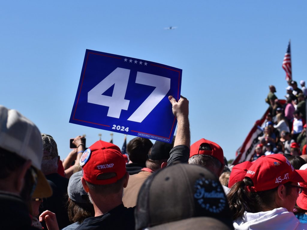 A rally attendee waves a sign reading ’47’ at Republican presidential nominee Donald Trump’s campaign event in Mosinee. Rob Mentzer/WPR