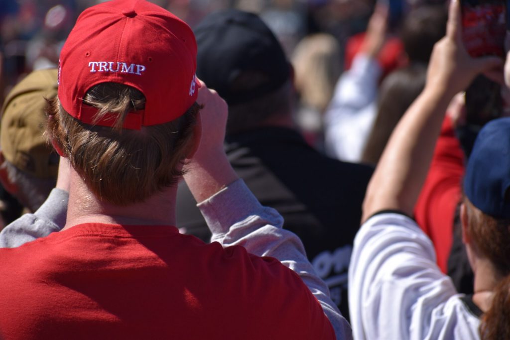 A supporter wears a Trump hat at the Mosinee campaign event. Rob Mentzer/WPR