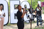 Mikayla Hughes singing during an early voting gathering at the Midtown Center in Milwaukee. (Photo | Isiah Holmes)