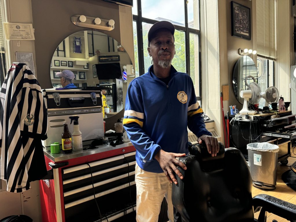 Antonio Perkins is a barber at Gee’s Clippers in Milwaukee. Evan Casey/WPR