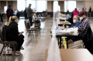 Observers, left, watch as workers recount ballots Monday, Nov. 23, 2020, at the Wisconsin Center in Milwaukee. Angela Major/WPR