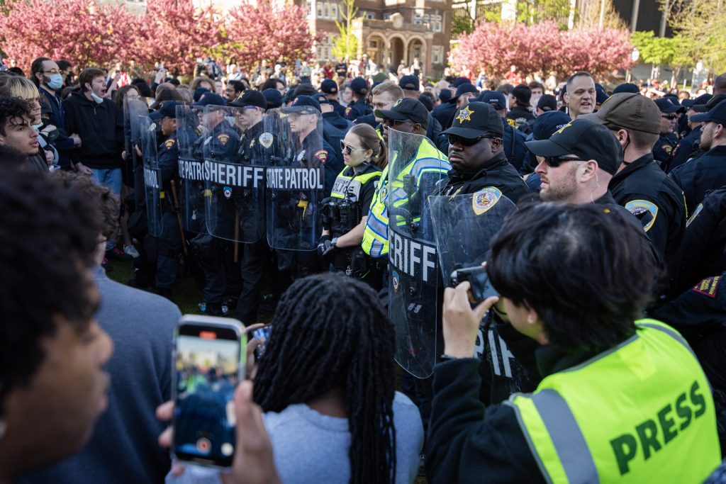 Police gather facing protesters at a pro-Palestinian encampment on the UW-Madison campus on May 1, 2024. Angela Major/WPR