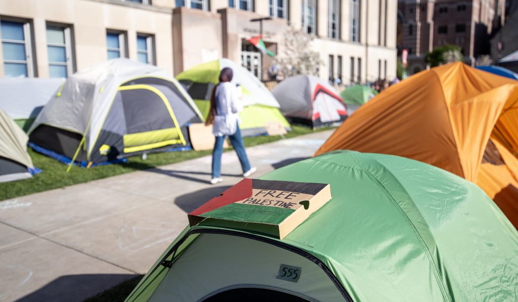 Signs are displayed on tents at a pro-Palestinian encampment Friday, May 3, 2024, at UW-Madison. Angela Major/WPR