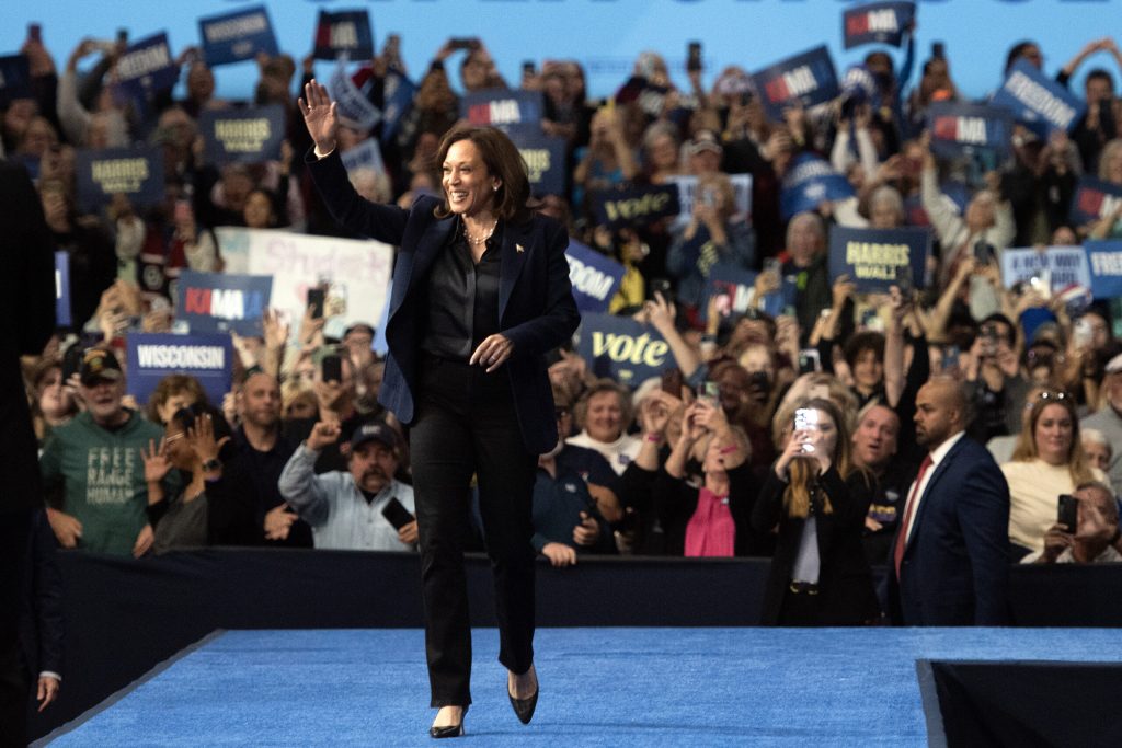 Vice President Kamala Harris smiles and waves to her supporters as she enters a campaign rally Thursday, Oct. 17, 2024, at UW-La Crosse, Wis. Angela Major/WPR