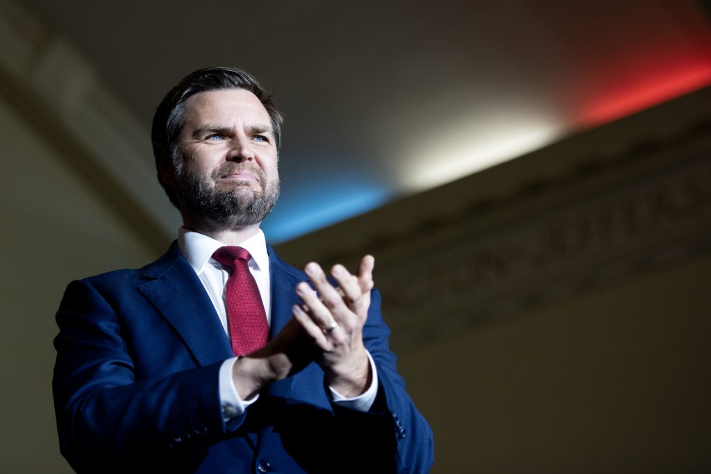 Republican vice presidential candidate JD Vance greets supporters as he steps on stage at a campaign rally Monday, Oct. 28, 2024, at Racine Memorial Hall in Racine, Wis. Angela Major/WPR