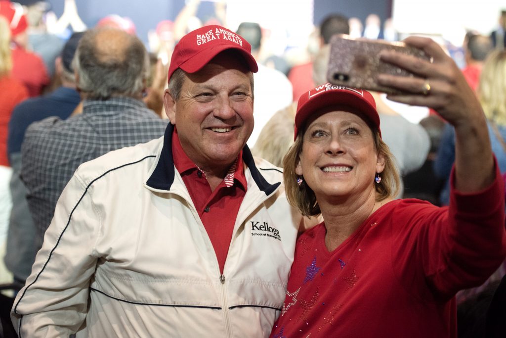 Supporters of Republican vice presidential candidate JD Vance take a selfie during his campaign event Monday, Oct. 28, 2024, at Racine Memorial Hall in Racine, Wis. Angela Major/WPR