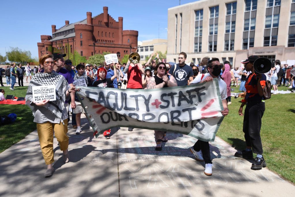 UW-Madison students, staff and faculty march from Library Mall to Bascom Hill as part of a pro-Palestinian encampment on May 6, 2024. Angela Major/WPR