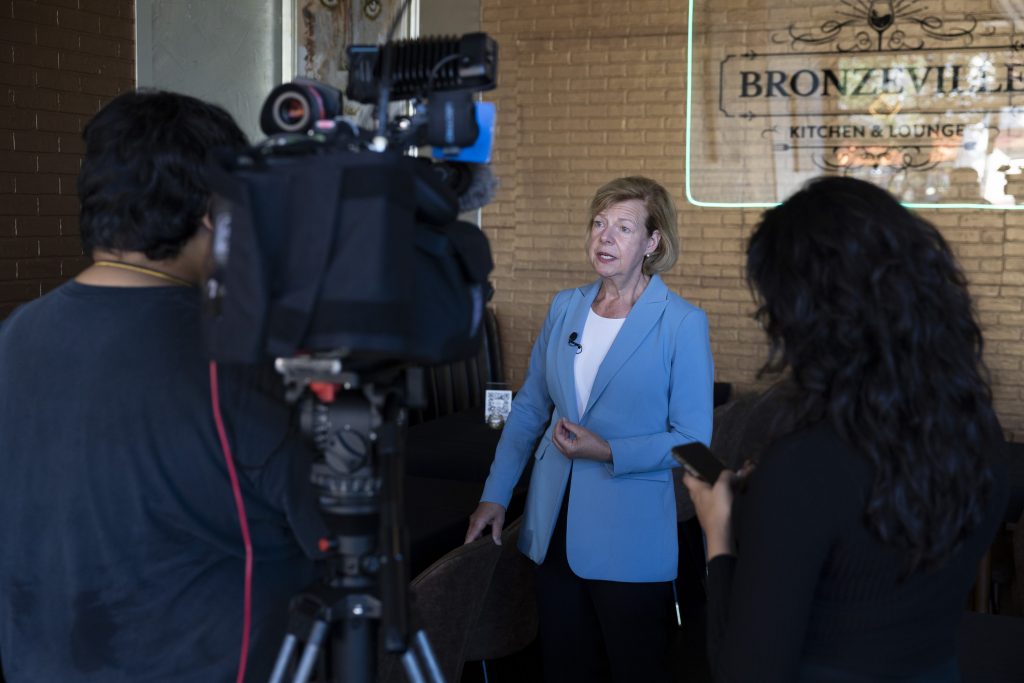 U.S. Sen. Tammy Baldwin, D-Wis., talks to the press after touring the Bronzeville Kitchen & Lounge in Milwaukee on Sept. 4, 2024. Baldwin points to her opposition to an Indo-Pacific trade deal as an example of a disagreement with the Biden administration over the effect it would have on American workers. (Joe Timmerman / Wisconsin Watch)