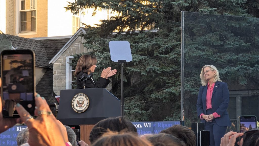 Vice President Kamala Harris applauds former U.S. Rep. Liz Cheney at a rally in Ripon on Thursday, Oct. 3. (Baylor Spears | Wisconsin Examiner)