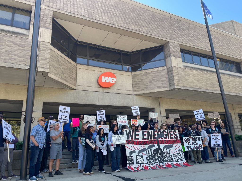 People protest We Energies’ proposed 2025-26 rate increases in downtown Milwaukee, Oct. 3, 2024. Nick Rommel/WPR