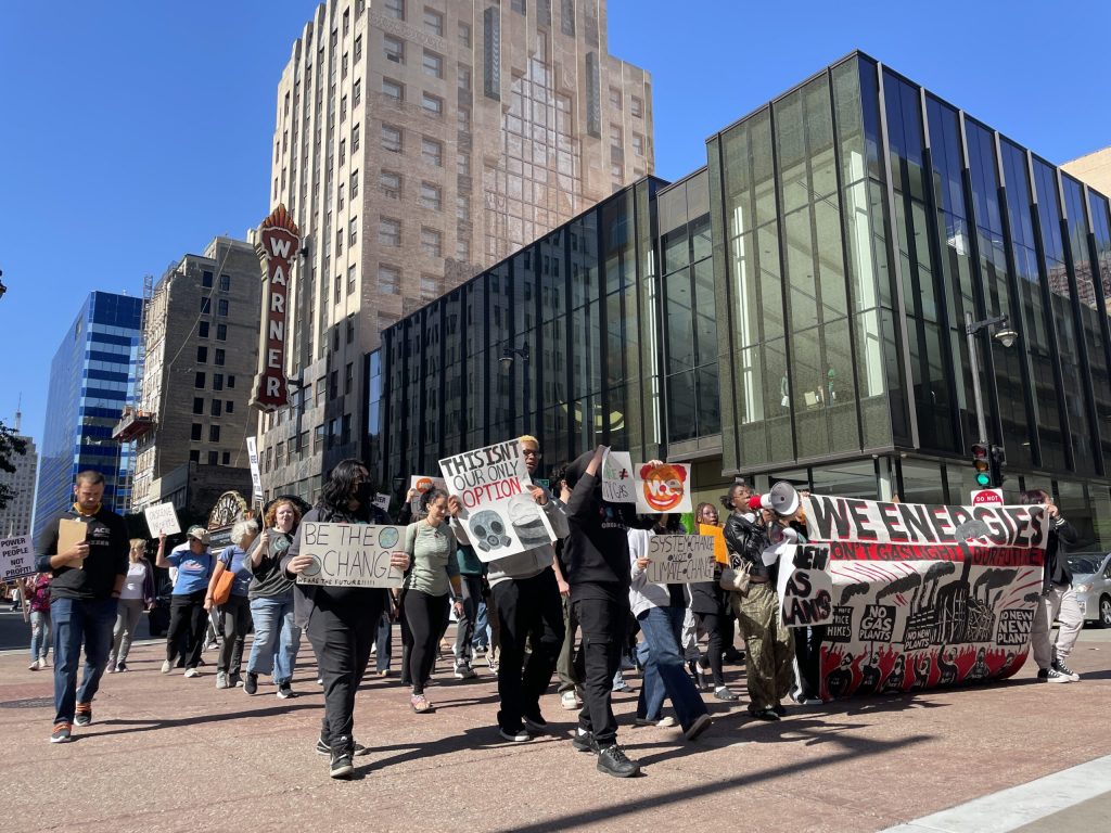 People protest We Energies’ proposed 2025-26 rate increases in downtown Milwaukee, Oct. 3, 2024. Nick Rommel/WPR