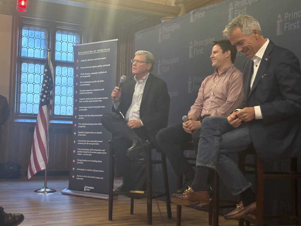 Charlie Sykes, Principles First founder Heath Mayo, and former Rep. Joe Walsh, R-IL, sit on a panel at Best Place at the Historic Pabst Brewery on July 17, 2024. Mackenzie Krumme/WPR