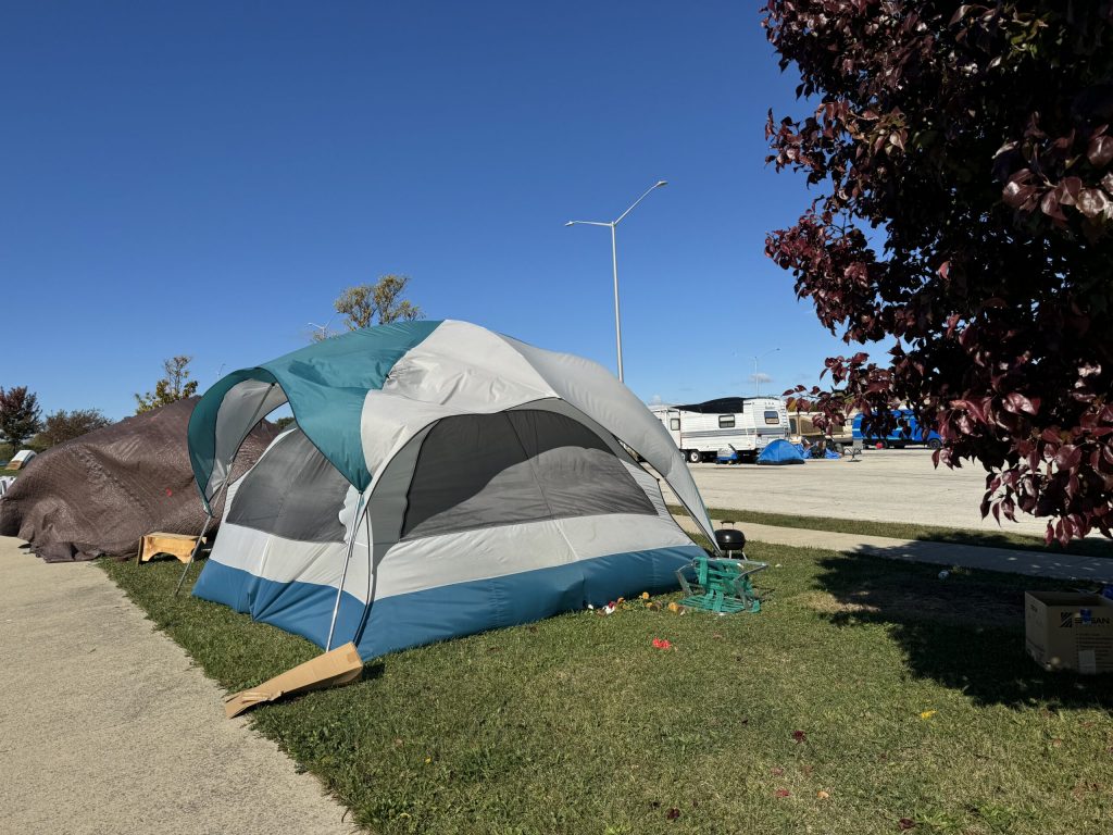 A homeless encampment can be seen here on one side of the College Avenue park and ride in Milwaukee on Oct. 14, 2024. Evan Casey/WPR