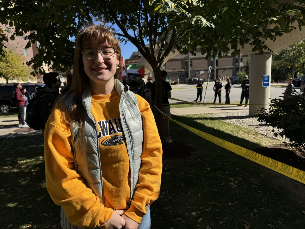 UW-Milwaukee student Phoebe Meyer stood outside of the university on Thursday, Oct. 17, 2024 to catch a glimpse of Vice President Kamala Harris. Evan Casey/WPR