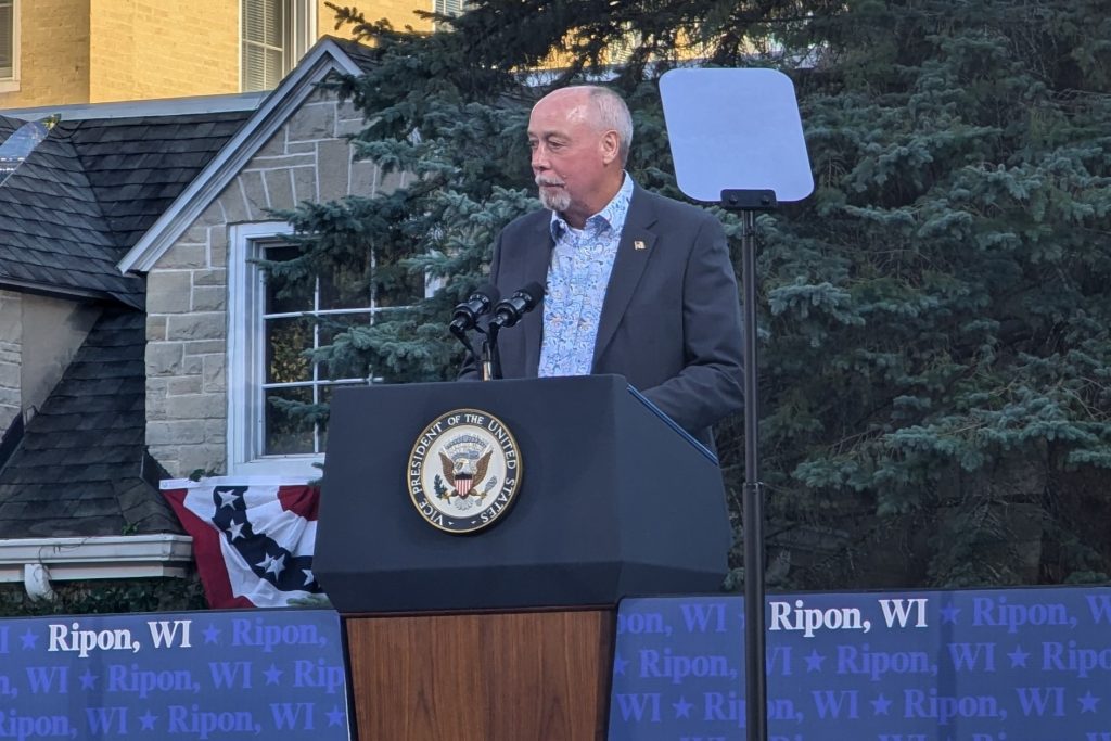 Former Iowa County Sheriff Steve Michek, a Republican supporting Vice President Kamala Harris for president, speaks ahead of former U.S. Rep. Liz Cheney at a Harris rally in Ripon Thursday, Oct. 3. (Baylor Spears | Wisconsin Examiner)