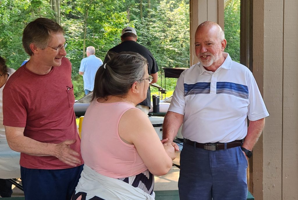 State Senate candidate Jim Rafter, R-Allouez, right, speaks to voters during a community picnic. Photo Courtesy of the Rafter campaign