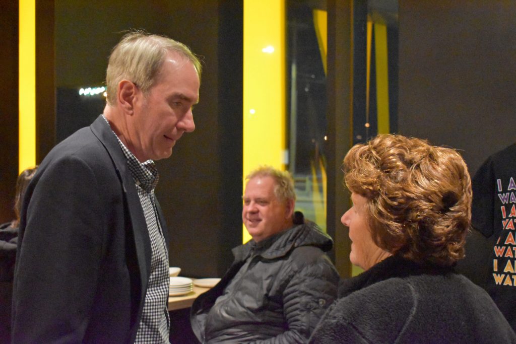 State Senate candidate Jamie Wall, D-Green Bay, left, speaks with a voter after a roundtable at Hinterland Brewery in Ashwaubenon on Oct. 16, 2024. Joe Schulz/WPR