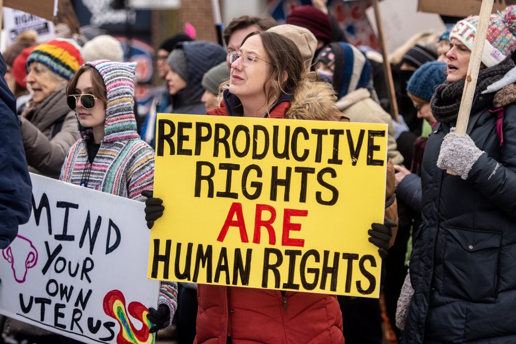 Protester Jennie Klecker participates in a march for abortion rights Sunday, Jan. 22, 2023, in Madison, Wis. “Theres nothing more important right now for my kids,” she said. Angela Major/WPR