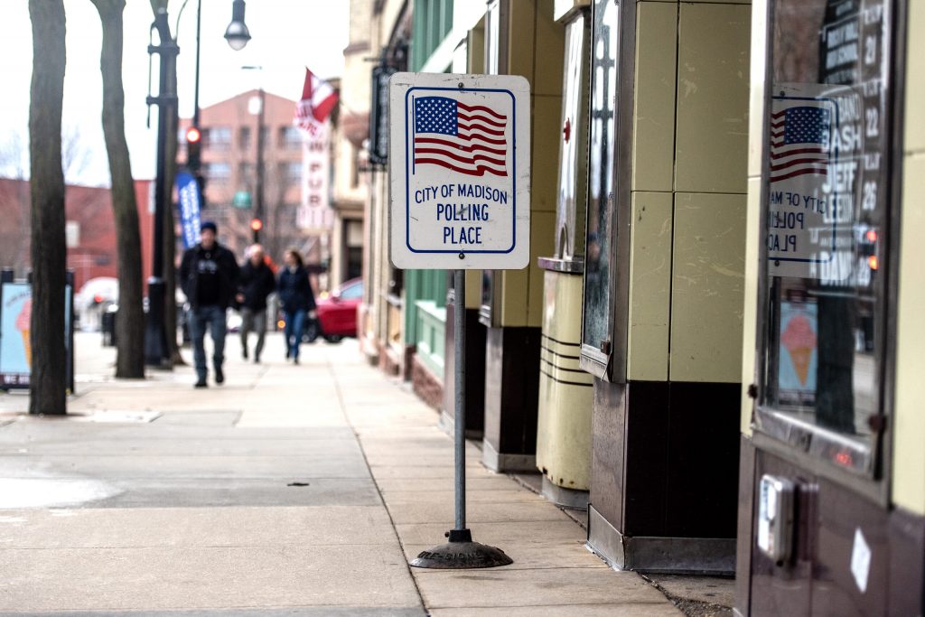 A sign is positioned outside of a polling location Tuesday, April 4, 2023, at Majestic Theatre in Madison, Wis. Angela Major/WPR