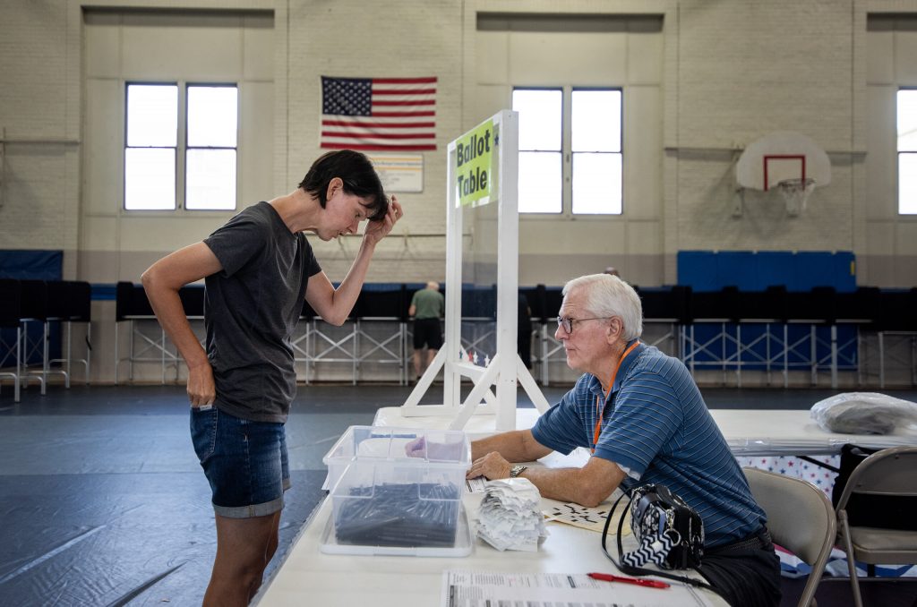 Fort Atkinson resident Sarah Thompson receives a ballot before voting Tuesday, Aug. 13, 2024, in Fort Atkinson, Wis. Angela Major/WPR