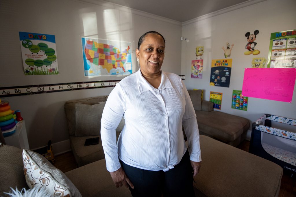 Pandora Washington stands in her Milwaukee home Tuesday, Oct. 29, 2024, where she has a day care center downstairs. Angela Major/WPR