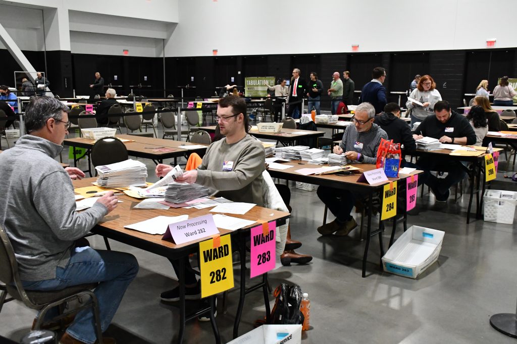 Election workers open and process absentee ballots at Milwaukee Central Count. Photo by Jeramey Jannene.