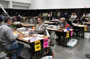 Election workers open and process absentee ballots at Milwaukee Central Count. Photo by Jeramey Jannene.