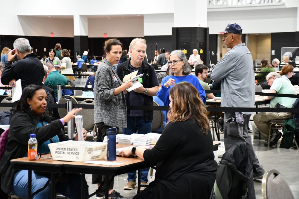 City of Milwaukee election worker Brenda Wood interacts with election observers at Central Count, Nov. 5. Photo by Jeramey Jannene.