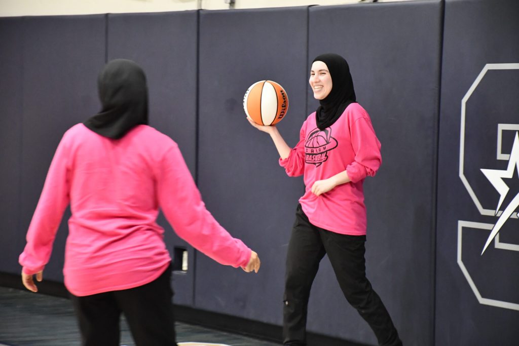 Junior Ola Bahhur of the Salam Stars during a basketball game. The all-Muslim girls basketball team is part of the Salam School district in Milwaukee. Mackenzie Krumme/WPR