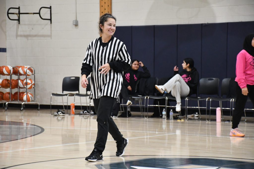 Coach Kassidi Macak refs during an alumni game of the Salam Stars of Milwaukee’s Salam School. Mackenzie Krumme/WPR