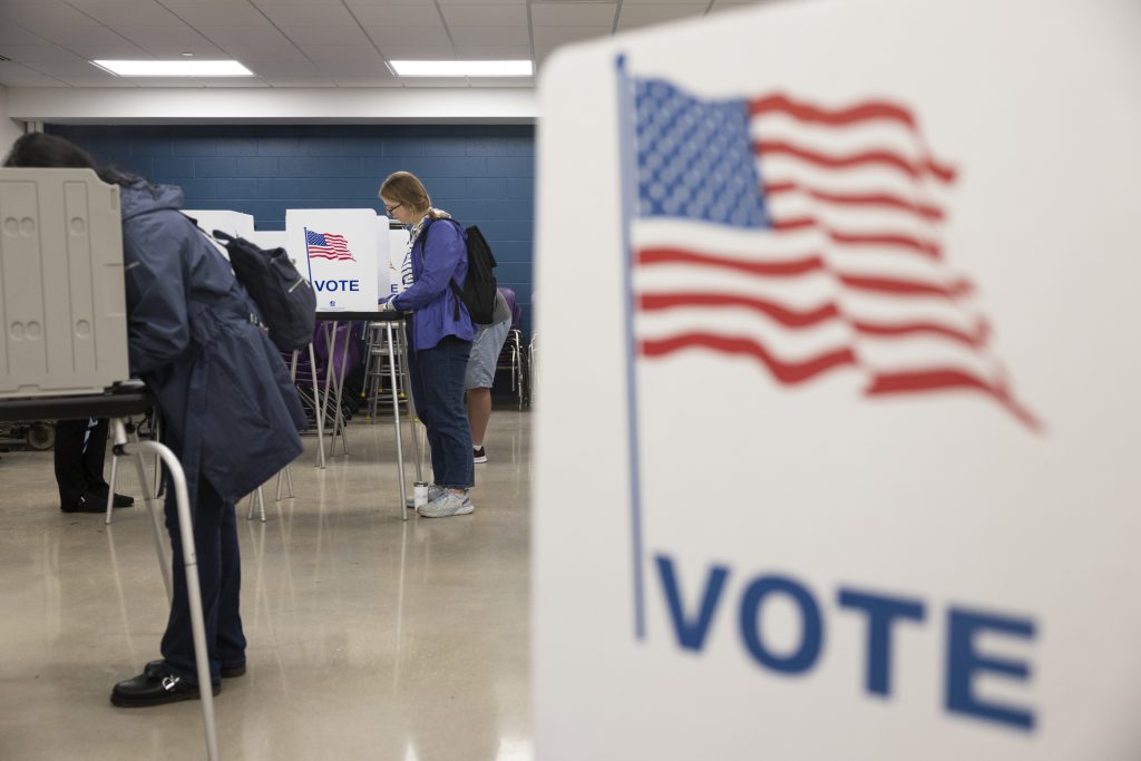 Jennifer Taylor, left, votes during Election Day on Nov. 5, 2024, at Madison East High School in Madison, Wis. (Joe Timmerman / Wisconsin Watch)