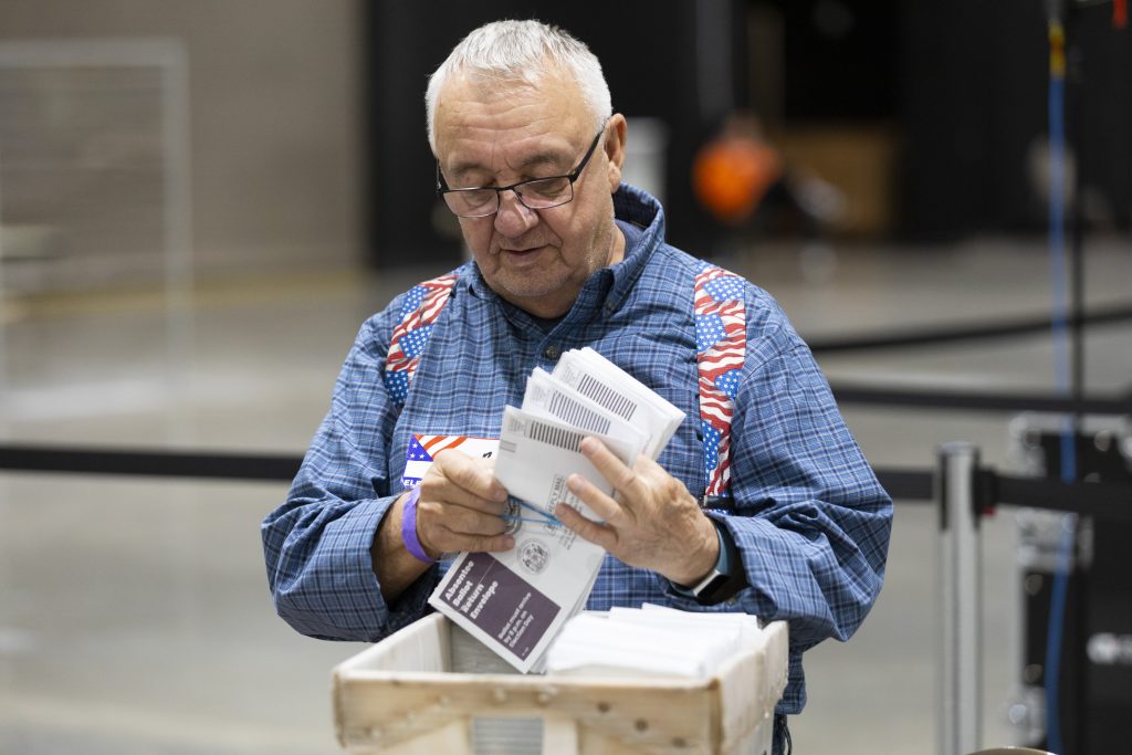 An election worker counts ballots on Election Day, Nov. 5, 2024, at Milwaukee Central Count at the Baird Center in Milwaukee. (Joe Timmerman / Wisconsin Watch)