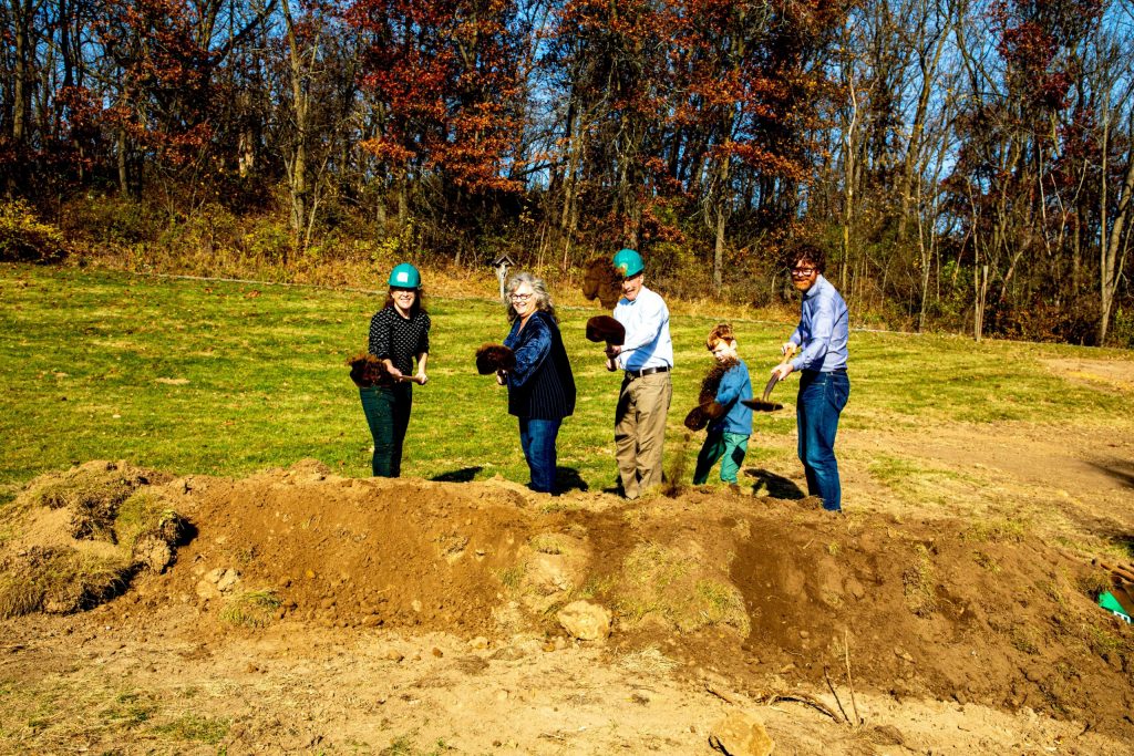 From left to right, Katherine May, Deb and Dan Carey, May’s son Teddy and husband, Scott, break ground on the new addition. Image courtesy of New Glarus Brewing Company.