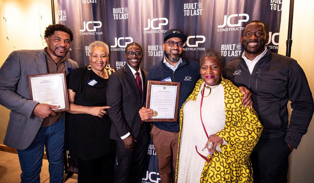 Jalin Phelps, Lynettee Phelps, Milwaukee County Executive David Crowley, Clifton Phelps, Milwaukee Community Leader Thelma Sias, and James Phelps, JCP Construction received a proclamation from the City of Milwaukee’s 6th District Alderwoman Milele Coggs. Photo courtesy of JCP Construction.