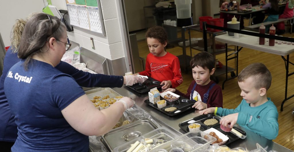 Kindergarten students at Suamico Elementary School go through the hot lunch line on March 8, 2023, in Suamico, Wis. Sarah Kloepping/Green Bay Press-Gazette