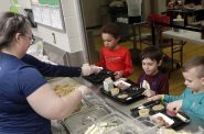 Kindergarten students at Suamico Elementary School go through the hot lunch line on March 8, 2023, in Suamico, Wis. Sarah Kloepping/Green Bay Press-Gazette