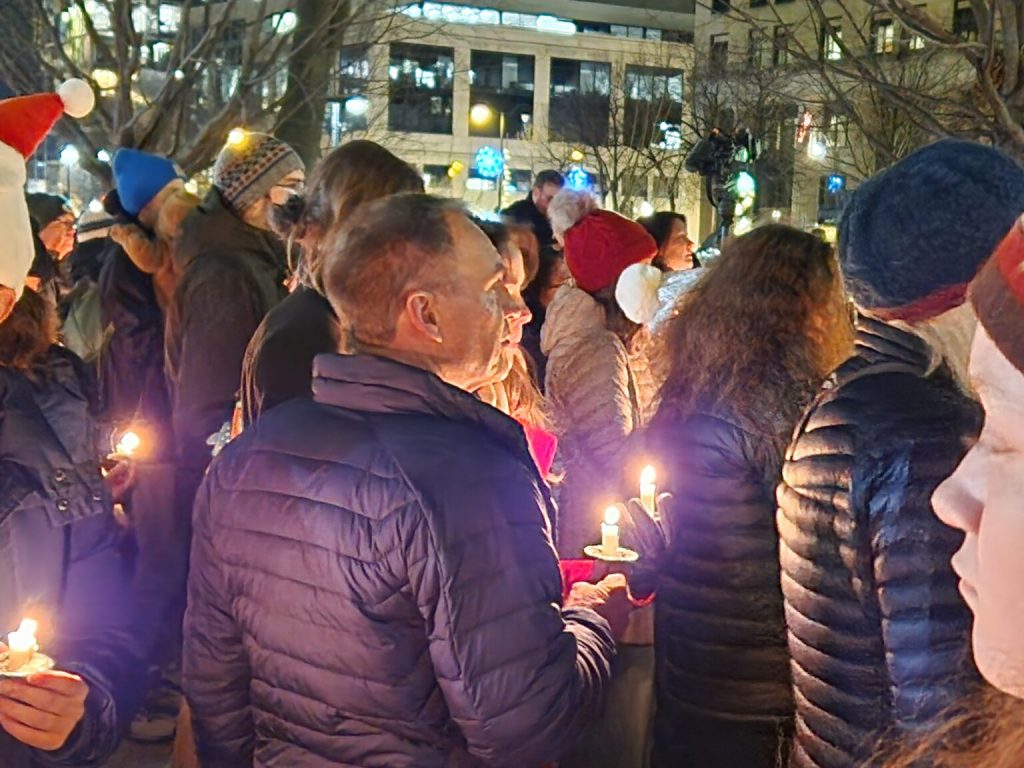 Several hundred people gathered on the Capitol Square in Madison Tuesday evening for a vigil following a school shooting Monday that left three dead and injured six other people. (Erik Gunn | Wisconsin Examiner)