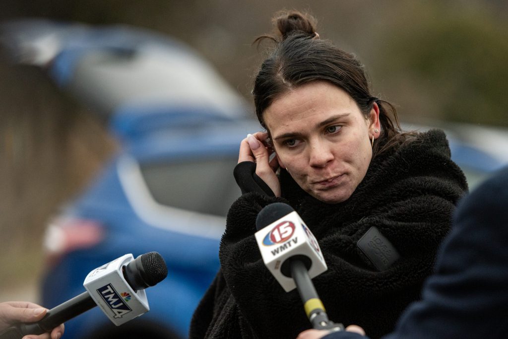 Bethany Highman, mother of a Abundant Life Christian School student, speaks to reporters near the reunification center Monday, Dec. 16, 2024, in Madison, Wis. Angela Major/WPR