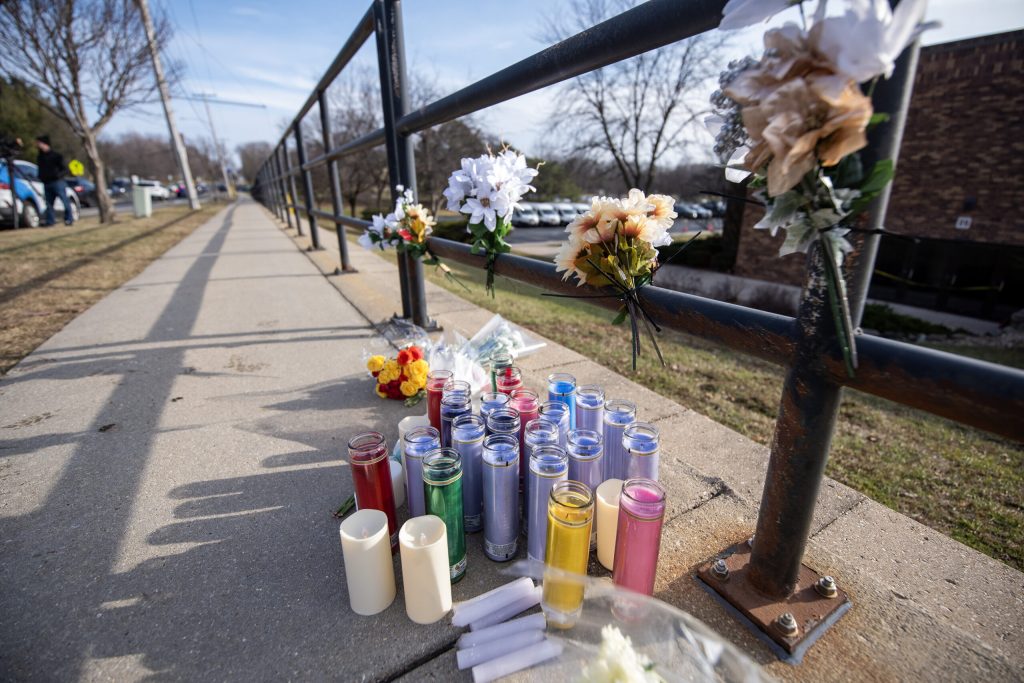 Candles and flowers are placed outside of Abundant Life Christian School the day after a fatal shooting Tuesday, Dec. 17, 2024, in Madison, Wis. Angela Major/WPR