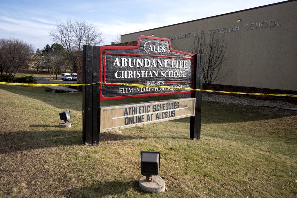 Police tape surrounds Abundant Life Christian School a day after a fatal shooting Tuesday, Dec. 17, 2024, in Madison, Wis. Angela Major/WPR