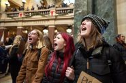 People participate in a walkout and protest led by West High School students in response to the Abundant Life Christian School shooting Friday, Dec. 20, 2024, at the Wisconsin State Capitol in Madison, Wis. Angela Major/WPR