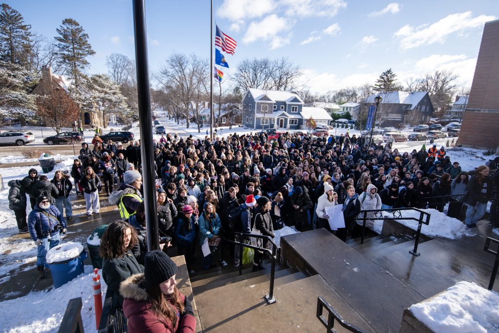 West High School students walk out of class in protest of gun violence Friday, Dec. 20, 2024, in Madison, Wis. Angela Major/WPR