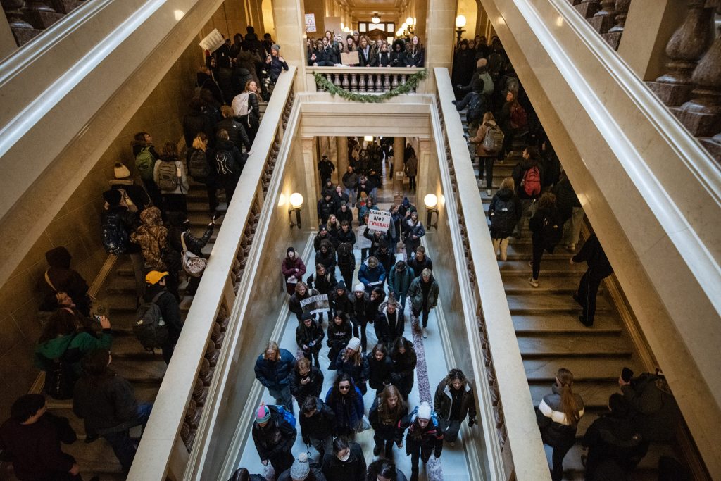 Student protesters enter the Wisconsin State Capitol after staging a walkout of West High School to protest gun violence following a shooting at Abundant Life Christian School on Friday, Dec. 20, 2024, in Madison, Wis. Angela Major/WPR