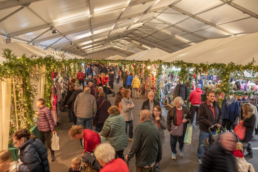 Visitors enter a heated tent at the Old World Christmas Market at The Osthoff Resort in 2023. Photo courtesy of the market.