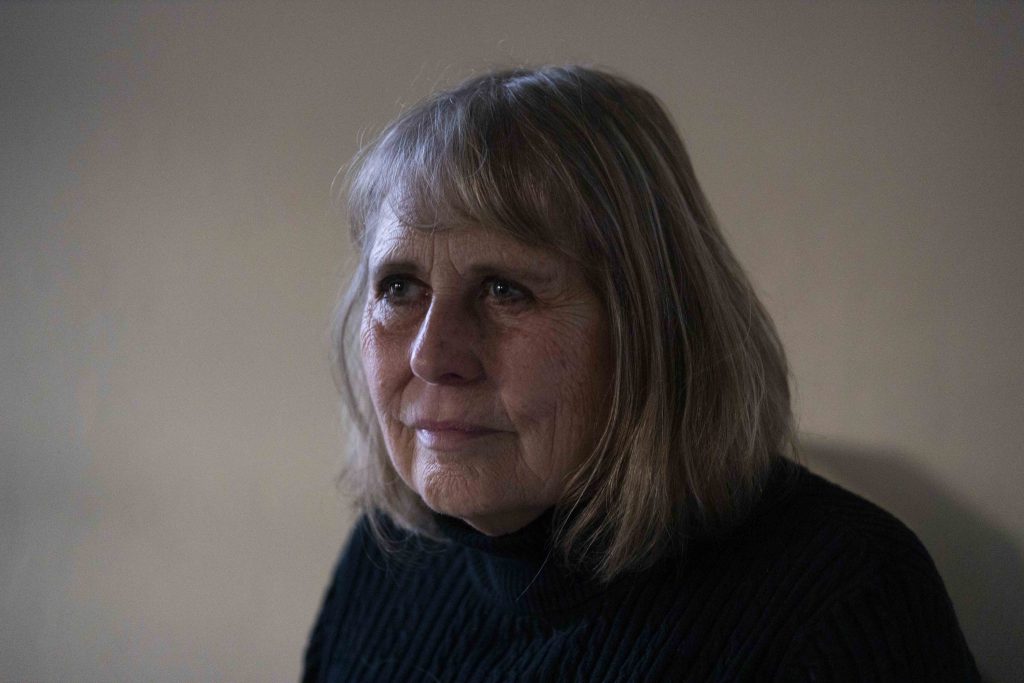 Dora Gorski poses for a portrait in her new home, Nov. 15, 2024, in Wausau, Wis. She still participates in a group called “People For Pine Crest,” which opposes a sale of Pine Crest Nursing Home in Merrill, where her late husband Ken spent the end of his life. (Joe Timmerman / Wisconsin Watch)