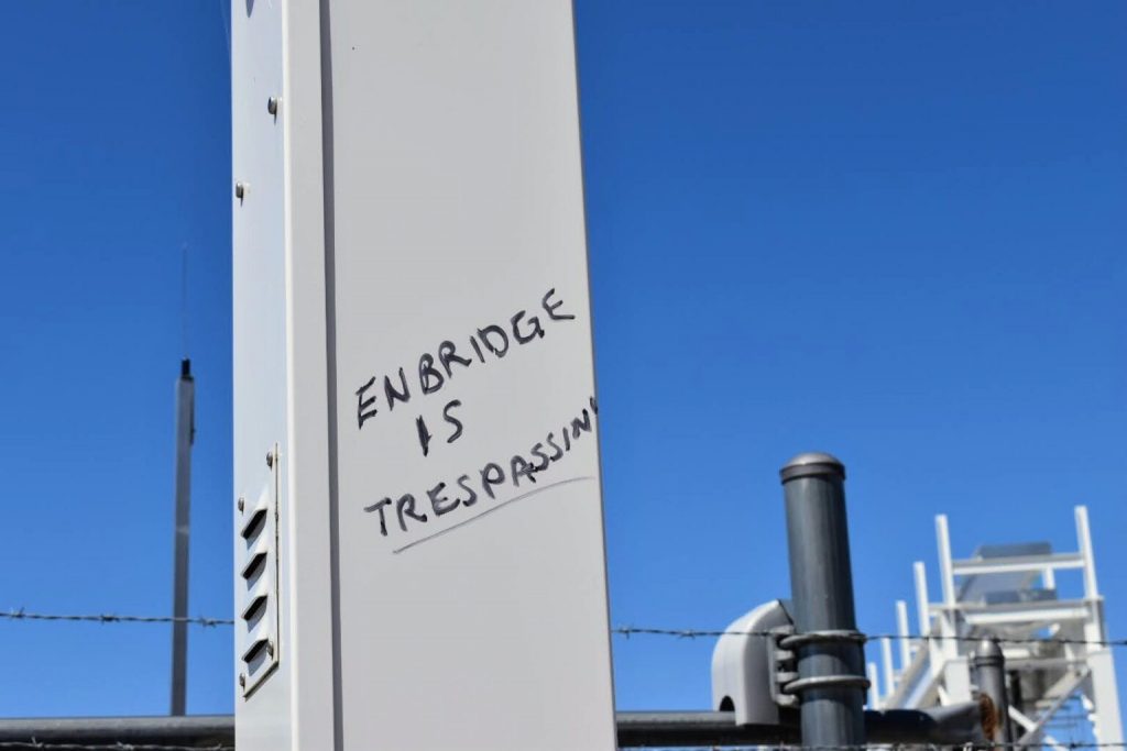 Anti-Line 5 graffiti at Enbridge’s pumping station in Mackinaw City, Mich., May 12, 2021. (Laina G. Stebbins | Michigan Advance)